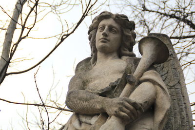 Low angle view of statue against sky