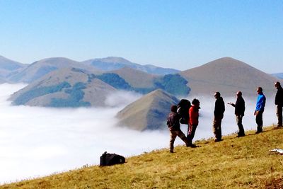 Tourists hiking on mountain