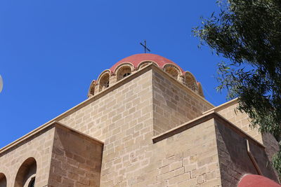 Low angle view of building against blue sky