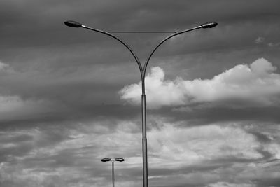 Low angle view of street light against sky