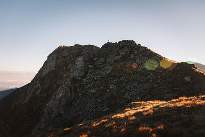 Low angle view of rock formations against sky