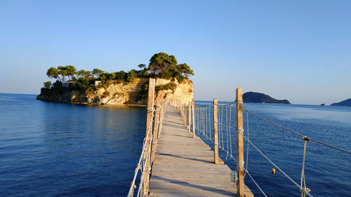 Scenic view of sea against clear blue sky