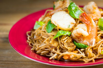 Close-up of shrimp and noodles served in plate on table