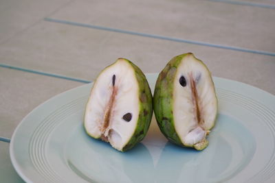 High angle view of fruits in plate on table