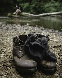 Close-up of black shoes on ground