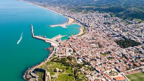 High angle view of city by sea