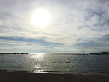 Scenic view of sea against cloudy sky