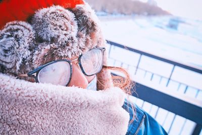 Close-up portrait of woman in snow