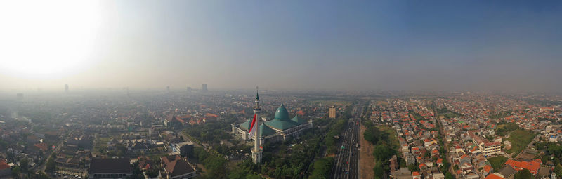 High angle view of city buildings against sky