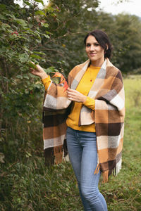 Young woman standing on field