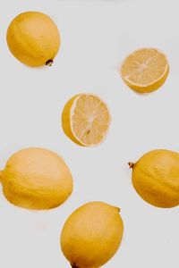 Close-up of oranges against white background