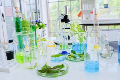 Glass of bottles on table