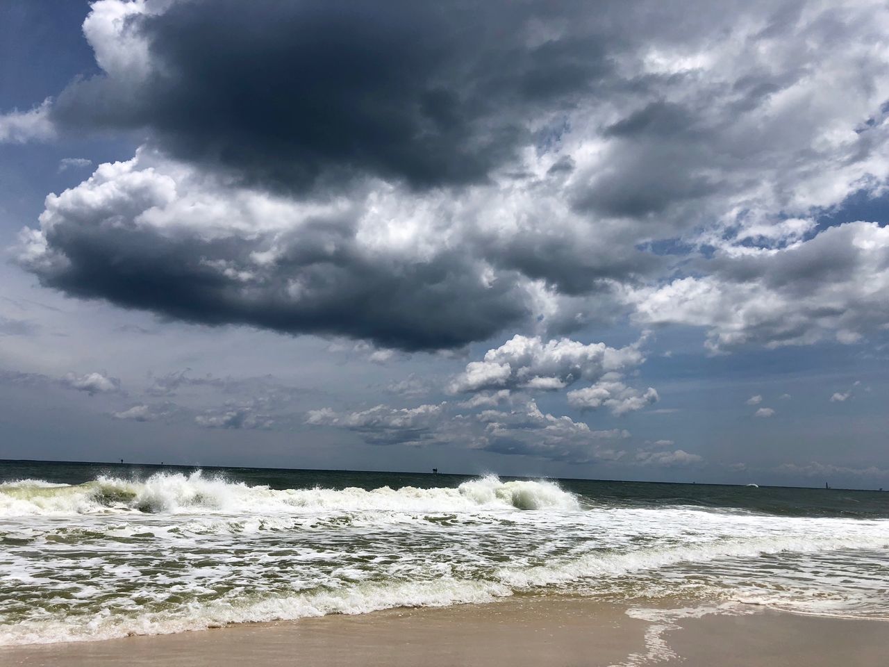 cloud - sky, sea, sky, water, wave, motion, beauty in nature, sport, beach, horizon over water, horizon, land, surfing, power in nature, aquatic sport, storm, scenics - nature, power, outdoors, ominous