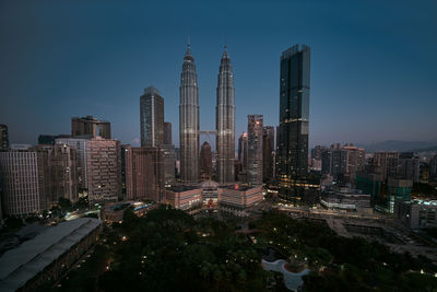 Panoramic view of buildings in city against sky