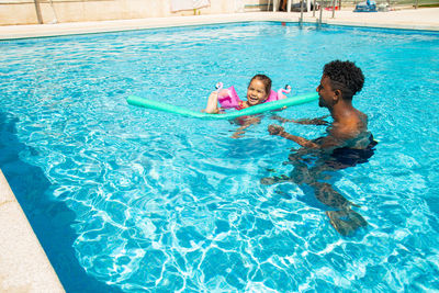 Man swimming in pool