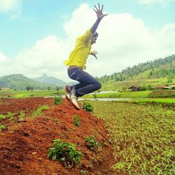 Woman jumping on field