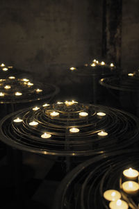 Close-up of illuminated lights on table