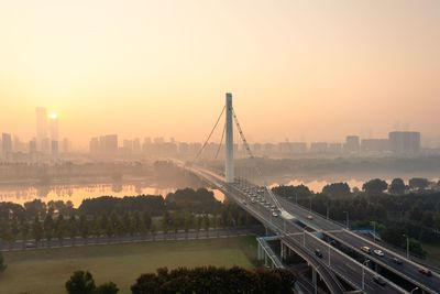 High angle view of city at sunset