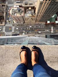 High angle view of woman standing on rooftop