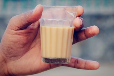 Close-up of hand holding drink