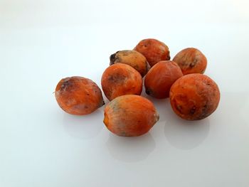 High angle view of oranges against white background