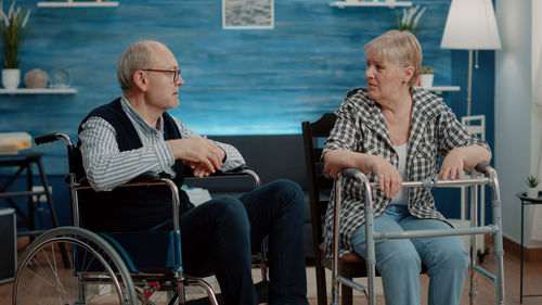 People sitting on chair at table