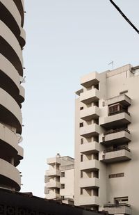 Low angle view of buildings against clear sky