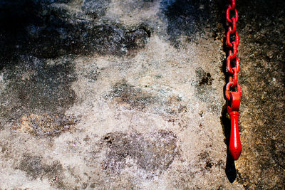 Red chain against wall