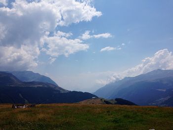 Scenic view of landscape and mountains against sky