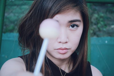 Close-up portrait of young woman