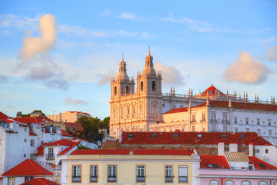 Buildings in city against sky