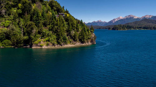 Scenic view of lake against blue sky