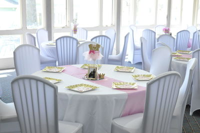 Empty chairs and tables in restaurant