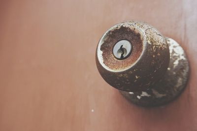 Close-up of rusty metal on table