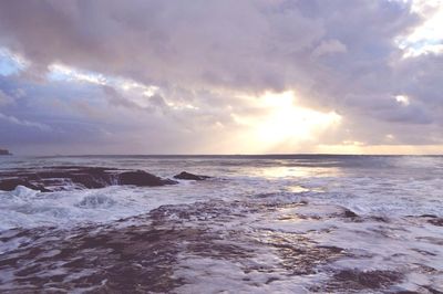 Scenic view of sea against cloudy sky