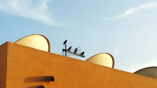 Low angle view of roof against sky