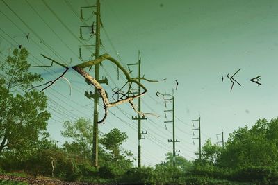 Low angle view of electricity pylon