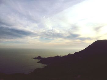 Scenic view of sea against cloudy sky