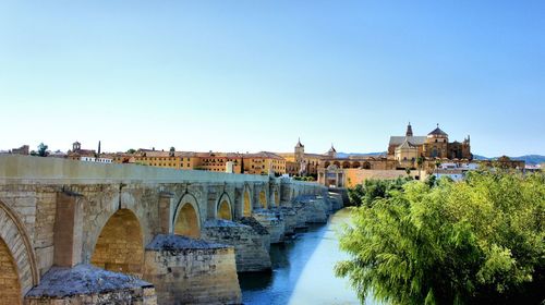 Bridge over river against clear sky