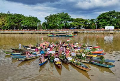 Boats in sea against sky