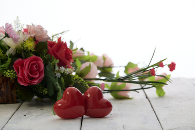 Close-up of red rose bouquet on tiled floor