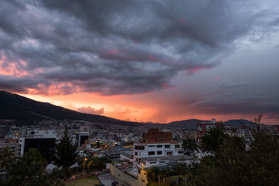 Townscape against sky during sunset