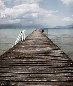 Pier over sea against sky
