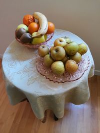 High angle view of fruits in plate on wooden table