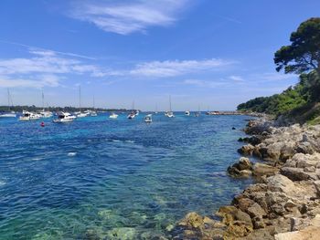 Scenic view of sea against blue sky