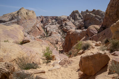 Rock formations in desert against sky