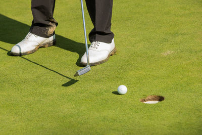 Low section of man playing with ball