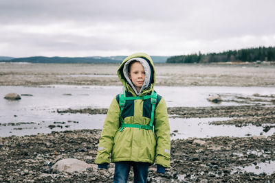 Portrait of a young boy alone hiking in northern sweden