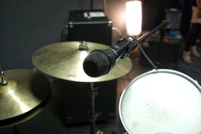 Close-up of microphone over drum kit
