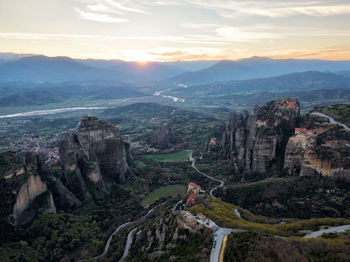 Scenic view of landscape against cloudy sky